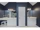 Elegant bathroom featuring double vanity sinks with granite counters, vanity area, and modern fixtures at 2738 Riderwood Ne Ln, Marietta, GA 30062
