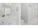Clean bathroom featuring a white vanity, sink, and a shower with white accents at 2738 Riderwood Ne Ln, Marietta, GA 30062