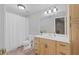 Well-lit bathroom with full-size shower/tub features white cabinets, sink, and updated fixtures at 2738 Riderwood Ne Ln, Marietta, GA 30062