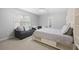 Inviting bedroom with a bed, gray sofa, and window that provides natural light at 2738 Riderwood Ne Ln, Marietta, GA 30062