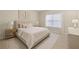 Neutral bedroom with a plush bed, soft lighting, carpet, and a window dressed with white curtains at 2738 Riderwood Ne Ln, Marietta, GA 30062