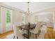 Elegant dining room with chandelier, large windows, and hardwood floors at 2738 Riderwood Ne Ln, Marietta, GA 30062