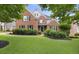 Charming two-story brick home with well-manicured lawn and lush landscaping at 2738 Riderwood Ne Ln, Marietta, GA 30062