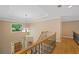 Foyer with hardwood floors, wooden banisters, and a view of the front door and mature trees at 2738 Riderwood Ne Ln, Marietta, GA 30062