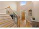 Bright foyer featuring hardwood floors, staircase with wrought iron railings, and ample natural light at 2738 Riderwood Ne Ln, Marietta, GA 30062