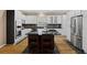 Modern kitchen with stainless steel appliances, white cabinets, and a large island at 2738 Riderwood Ne Ln, Marietta, GA 30062