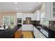 Bright kitchen features white cabinets, granite countertops, and stainless steel appliances at 2738 Riderwood Ne Ln, Marietta, GA 30062