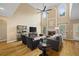 Open living room with fireplace, hardwood floors, vaulted ceiling, and arched windows at 2738 Riderwood Ne Ln, Marietta, GA 30062