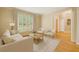 Cozy living room featuring neutral tones, plush seating, hardwood floors and natural light at 2738 Riderwood Ne Ln, Marietta, GA 30062