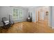 Comfortable living room featuring hardwood floors, a rocking chair, and an entrance with a wooden door at 2738 Riderwood Ne Ln, Marietta, GA 30062