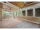 Sunroom with wood ceiling and columns, outdoor seating, and an American flag at 2738 Riderwood Ne Ln, Marietta, GA 30062
