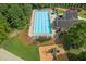 Aerial view of an expansive community swimming pool, clubhouse, playground, and lots of seating at 2738 Riderwood Ne Ln, Marietta, GA 30062