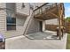 Backyard patio with a basketball hoop, an outdoor grilling area, and access to the upper-level deck at 4568 Mantova Dr, Buford, GA 30519