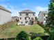 Fenced backyard showcasing a patio, swing set, deck, and lush lawn, ideal for outdoor enjoyment at 4568 Mantova Dr, Buford, GA 30519
