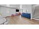 Spacious finished basement with wood-look flooring, recessed lighting, and ample space for play and entertainment at 4568 Mantova Dr, Buford, GA 30519