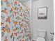 Cozy bathroom with printed shower curtain and elephant art at 4568 Mantova Dr, Buford, GA 30519