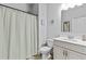 Well-lit bathroom featuring a shower and a sink with vanity at 4568 Mantova Dr, Buford, GA 30519