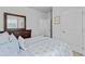Bright bedroom with a large mirror and door to another room at 4568 Mantova Dr, Buford, GA 30519