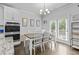 Bright dining area with modern lighting, and easy access to a rear deck at 4568 Mantova Dr, Buford, GA 30519