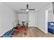 Dedicated exercise room with a ceiling fan, weightlifting equipment, and wood-look flooring at 4568 Mantova Dr, Buford, GA 30519