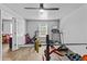 Exercise room is well-equipped with weights, exercise bike, and treadmill, enhanced by natural light at 4568 Mantova Dr, Buford, GA 30519
