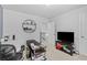 Simple home office with a desk, computer, and tv at 4568 Mantova Dr, Buford, GA 30519