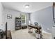Bright home office with a modern desk and shelving unit at 4568 Mantova Dr, Buford, GA 30519