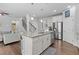Bright kitchen featuring an island with granite countertops and stainless steel appliances at 4568 Mantova Dr, Buford, GA 30519