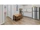 Well-lit kitchenette boasts stainless steel appliances, white cabinets, and a comfortable dining space at 4568 Mantova Dr, Buford, GA 30519