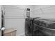 Functional laundry room with modern washer, dryer, and shelving at 4568 Mantova Dr, Buford, GA 30519