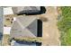 Aerial view of the property showcasing the home's roof and surrounding landscape at 5470 Beaver Ridge Dr, Cumming, GA 30040
