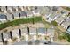 Aerial view of homes in a neighborhood showcasing their well-maintained yards and proximity to each other at 5470 Beaver Ridge Dr, Cumming, GA 30040