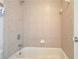 Clean bathroom featuring a tiled shower and a white tub at 5470 Beaver Ridge Dr, Cumming, GA 30040