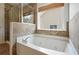 Bright bathroom with soaking tub and glass shower at 5470 Beaver Ridge Dr, Cumming, GA 30040