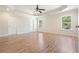 Expansive primary bedroom boasts hard surface floors, tray ceiling and multiple windows at 5470 Beaver Ridge Dr, Cumming, GA 30040