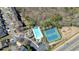 An aerial shot captures a community's resort-style amenities including a pool, tennis courts, and playground at 5470 Beaver Ridge Dr, Cumming, GA 30040
