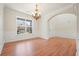 Open-concept dining area boasts hardwood floors, natural light, and detailed trim at 5470 Beaver Ridge Dr, Cumming, GA 30040