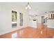 Inviting dining area with French doors, hardwood floors, and an open view to the living area at 5470 Beaver Ridge Dr, Cumming, GA 30040