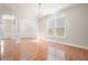 Open dining room with hardwood floors, detailed trim, and a chandelier at 5470 Beaver Ridge Dr, Cumming, GA 30040