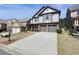 Attractive two-story home with a spacious driveway, stone accents, and an attached two car garage at 5470 Beaver Ridge Dr, Cumming, GA 30040