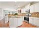 Kitchen with white cabinets, granite countertops, a stainless steel oven, and an island at 5470 Beaver Ridge Dr, Cumming, GA 30040