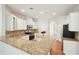 Gourmet kitchen with granite countertops, stainless steel appliances, and custom cabinetry at 5470 Beaver Ridge Dr, Cumming, GA 30040