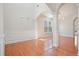 Elegant living room showcasing hardwood floors, decorative columns, and a decorative chandelier at 5470 Beaver Ridge Dr, Cumming, GA 30040