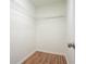 Bright walk-in closet with metal shelving and wood-look floors at 5470 Beaver Ridge Dr, Cumming, GA 30040