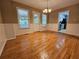 Sunlit dining room with wood floors and kitchen access at 105 Old Hickory Pointe, Mcdonough, GA 30252