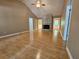 Spacious living room featuring hardwood floors and stone fireplace at 105 Old Hickory Pointe, Mcdonough, GA 30252