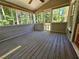 Relaxing screened porch with wooded views and ample space at 105 Old Hickory Pointe, Mcdonough, GA 30252