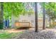 Backyard with wooden deck and trees at 5292 Mountain Village Ct, Stone Mountain, GA 30083