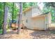 Backyard with wooden deck and trees at 5292 Mountain Village Ct, Stone Mountain, GA 30083