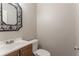 Half bath features a decorative mirror and vanity at 5292 Mountain Village Ct, Stone Mountain, GA 30083